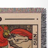 Blanket with 'The Sun' tarot card design, featuring colorful fringe.