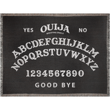 Ouija board design on a black woven blanket with white text.
