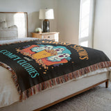 Decorative blanket on a bed in a bedroom.